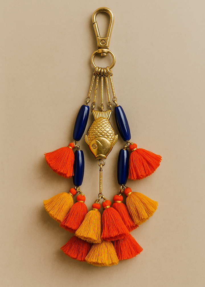 Decorative keychain with tassels on a beige background