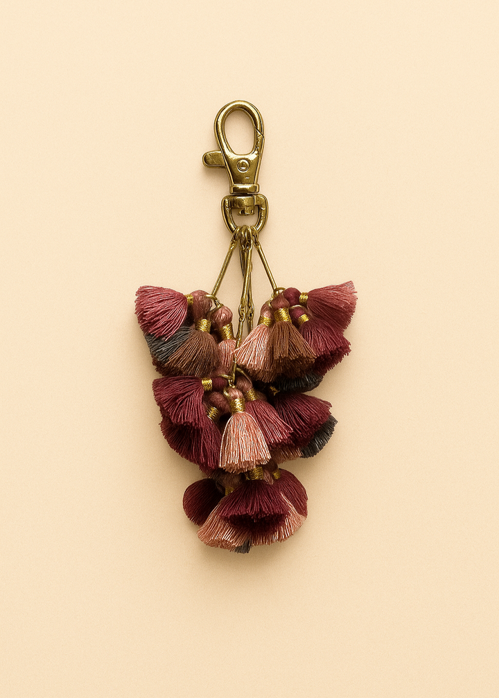 Keychain with tassels on a beige background